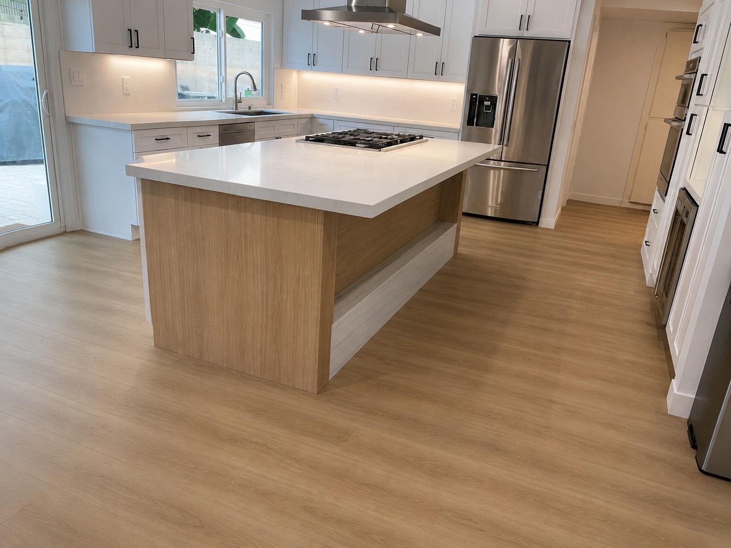 Custom kitchen remodel with large island and luxury finishes by California Building Innovations
